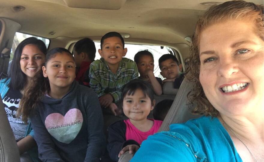 Danya Gresham (right) takes a selfie with some of the kids she helps take care of in this undated photo.