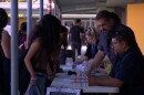 Bell Middle School students pick up their class schedules on the first day of school on Monday, Aug. 11, 2025.