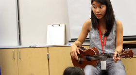 Zoe Kumagai, 23, a new music teacher at Veterans Elementary School in Chula Vista, California, instructs a group of kindergarten students. 