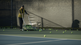 Tammy Redondo is seen pushing a cart full of tennis balls in this undated still from the "Love All" documentary.
