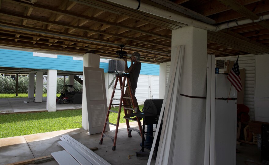 A construction worker at Amy Tripp's new home, which still needs a lot of work.