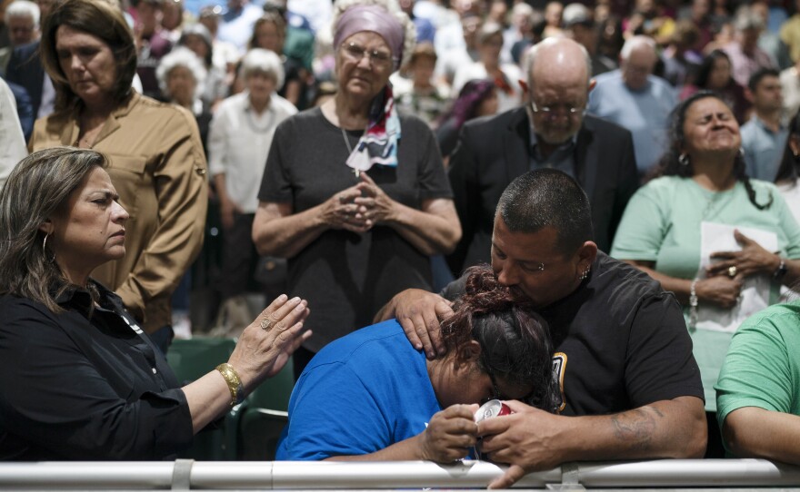 Two family members of one of the victims killed in a shooting at Robb Elementary School comfort each other during a prayer vigil in Uvalde, Texas, on Wednesday.