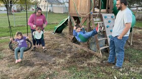Joe and Alisha Bartleson play with their children on the swing set in their yard in Buffalo, Iowa. They think Donald Trump is the best Republican candidate to take on Joe Biden in 2024.