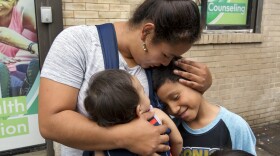 In this Friday, Aug. 3, 2018 file photo, Honduran Eilyn Carbajal hugs her then-8-year-old son Nahun Eduardo Puerto Pineda, right, after they were reunited at the Cayuga Center, in New York.