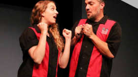 Zach Stones, associate director of the National Comedy Theatre on stage next to fellow actor Alison Ramsay, 2018.