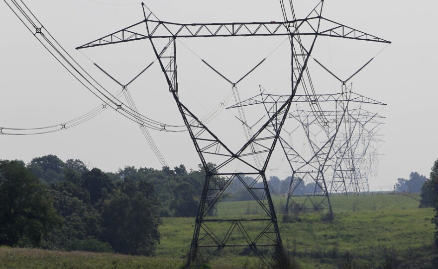 Electric lines extend over the hills of Owen County near Owenton, Ky. A lengthy, blistering heat wave that is blanketing the eastern United States is putting significant stress on the nation's power grid as homeowners and businesses crank up their air conditioners.