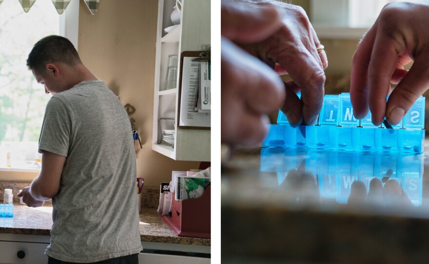 Greg's son Conor helps his dad organize medications. Greg takes multiple drugs to treat the symptoms of Alzheimer's.
