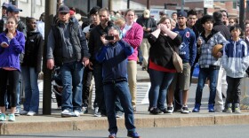  People look on after two bombs exploded during the 117th Boston Marathon on April 15, 2013 in Boston, Massachusetts.