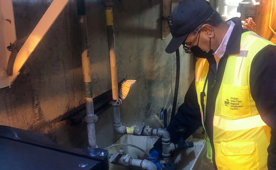 Globs of black sludge come out of a faucet in a tunnel under the <a href="https://www.sanjoseca.gov/your-government/environment/water-utilities/regional-wastewater-facility">San José-Santa Clara Regional Wastewater Facility</a>. Scientists collect samples of the solids that collect here.