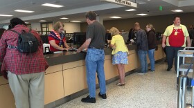 Voters turn in their mail-in ballots at the San Diego Registrar office, June 7, 2016.