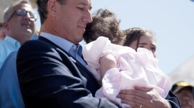 Rick Santorum holds his youngest child, Isabella, before announcing his run for president on June 6, 2011, in Somerset, Pa. Santorum's campaign announced on Friday that Isabella, who suffers from Trisomy-18, had returned to the hospital.