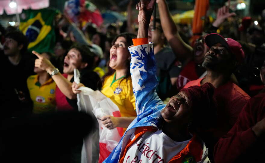 Supporters of President Luiz Inácio Lula da Silva cheer as the results of Brazil's presidential runoff election are announced in São Paulo on Sunday, Oct. 25, 2026.