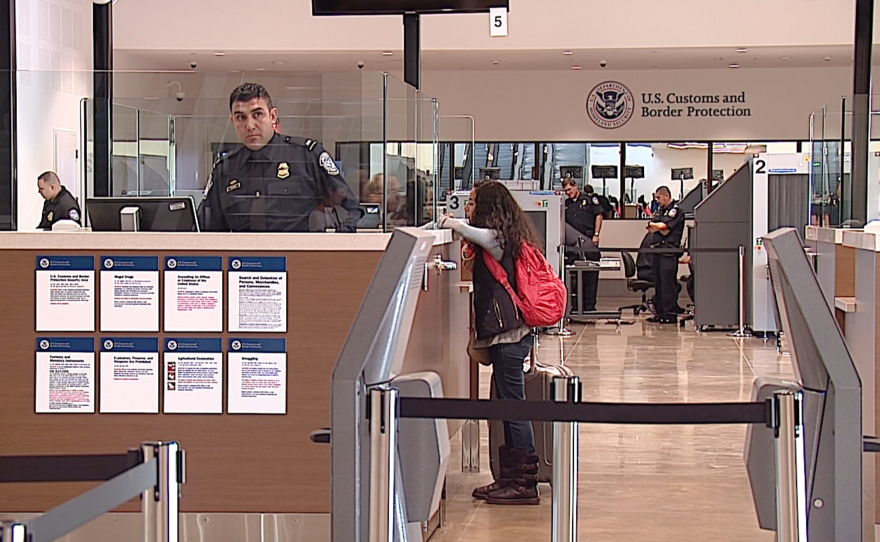 A woman goes through U.S. Customs and Border Protection after walking through the Cross Border Xpress, Dec. 9, 2015.