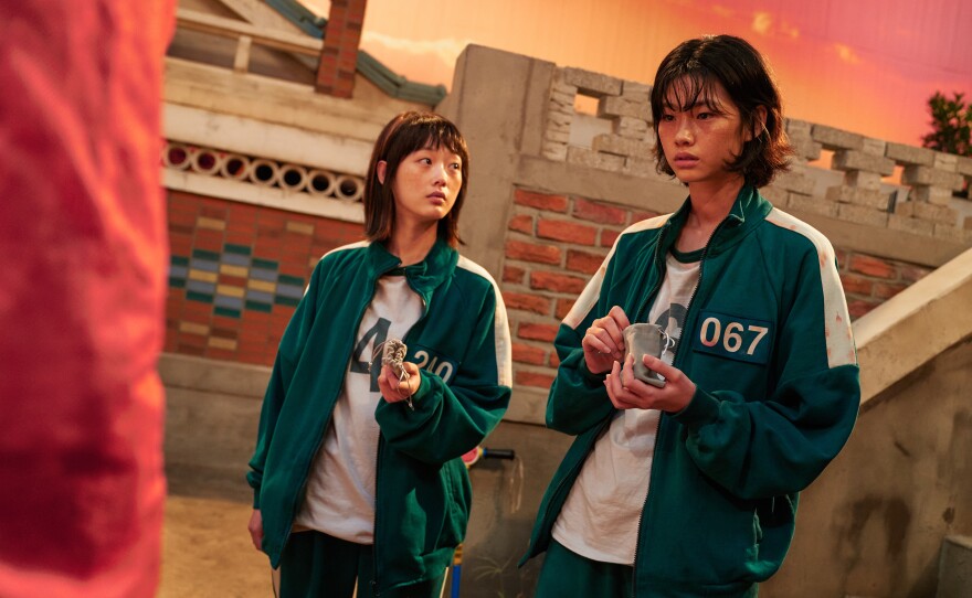 Sae-byeok and her marble game partner Ji-yeong.