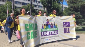 Childcare providers, including from left, Justine Flores, Sylvia Hernandez, Rasiene Reece and Zoila Toma, right, rallied at the at the Capitol, in Sacramento, Calif., June 24, 2021.