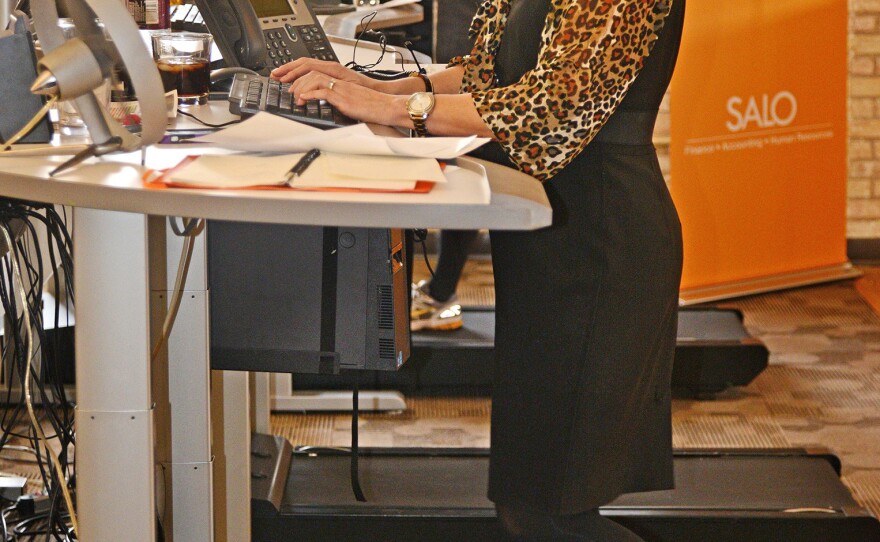 Maura Howard tries to log about three miles a day on a treadmill desk at Salo, a financial staffing company in Minneapolis. She says regular walking helps her avoid after-lunch drowsiness.