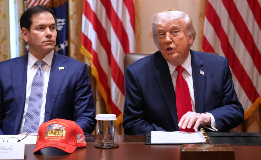 President Trump, next to Secretary of State Marco Rubio, speaks during a Cabinet meeting at the White House on Wednesday.