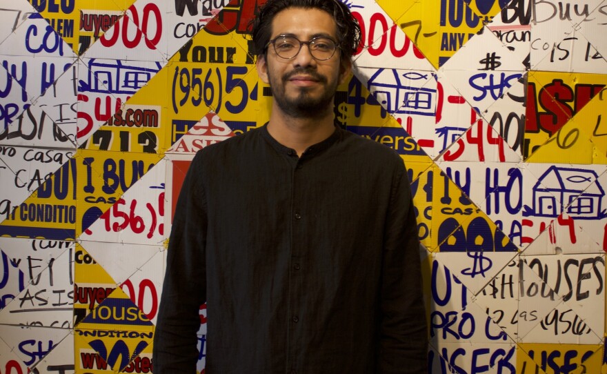 Artist and writer Josué Ramirez stands before one of his pieces at his gallery "Who's the Bandit?" in Weslaco at South Texas College's library.