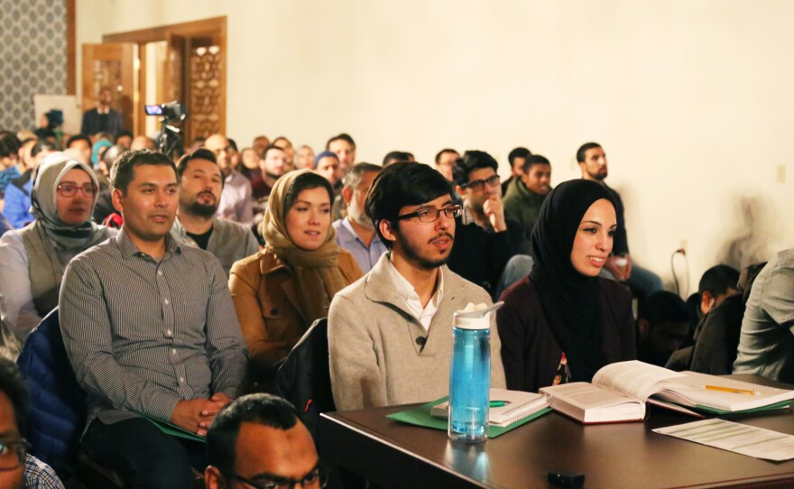 Attendees listen to a presentation at the Portrait of a Prophet course in Lanham, Md. Men and women sat side by side at this lecture, which was less formal than Friday services.