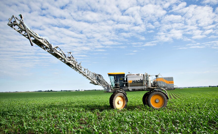 A farmer applies fertilizer to soybeans in Kasbeer, Ill. Scientists say one significant source of nitrogen pollution is fertilizer that leaks off of fields growing corn and soybeans to feed meat and dairy animals.