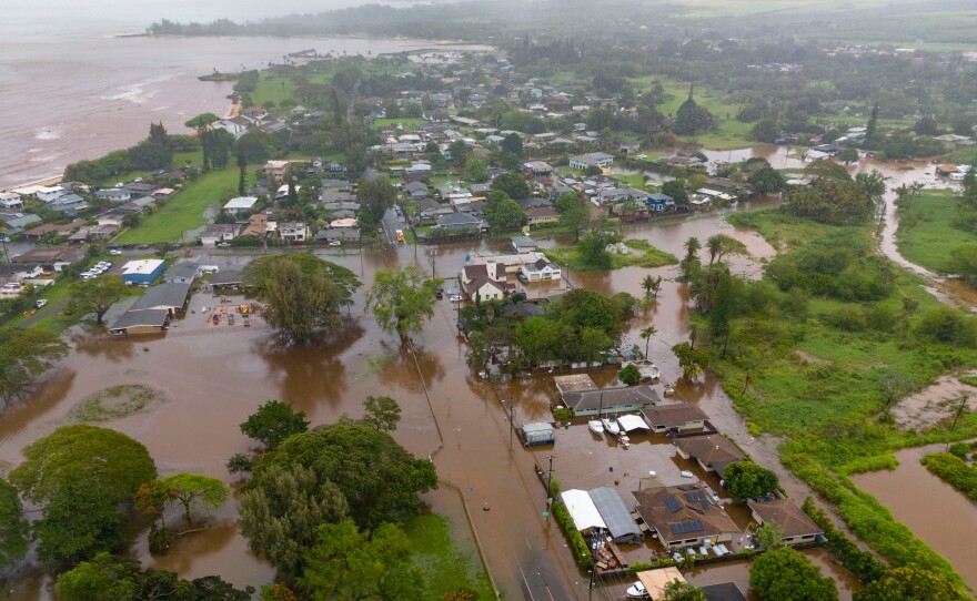 Streets are flooded from severe rains Friday in Haleiwa, Hawaii.