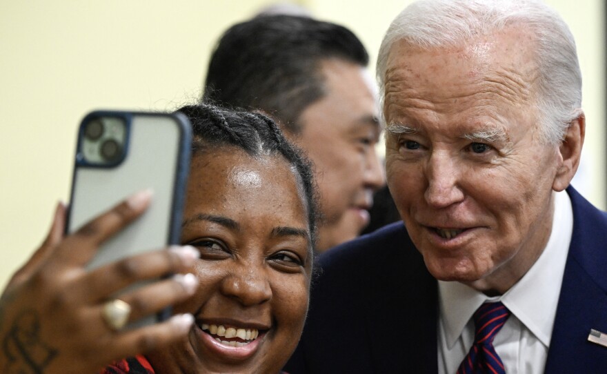 President Biden takes a selfie with a customer at CJ's Cafe in Los Angeles, Calif. on Feb. 21, 2024.