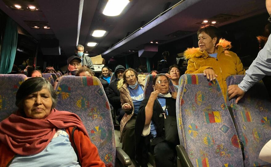 Elitania Tellez Maldonado and Camilo Rodriguez Mares wait on the bus after arriving in Birmingham, Ala., from Michoacan, Mexico.