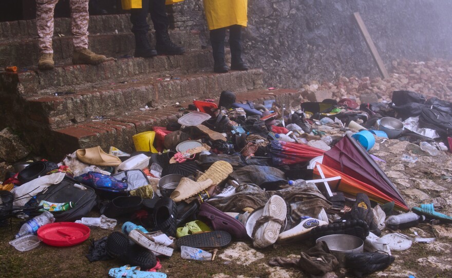 The shoes of victims of a deadly stampede sit by the main entrance of the Citadelle Laferriere in Milot, Haiti, Sunday, April 12, 2026.