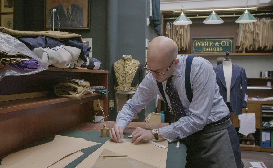 Tristan Thorne of Henry Poole & Co. marks down measurements for a custom fit suit.