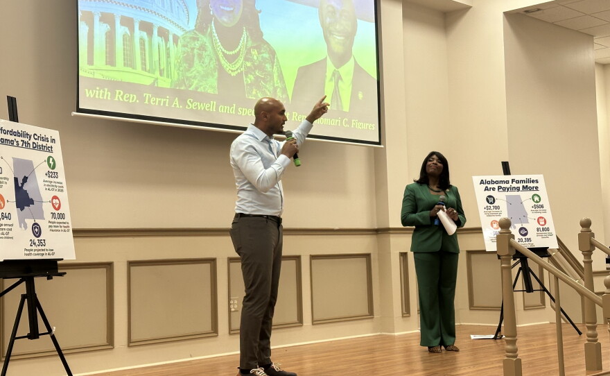 Democratic Reps. Shomari Figures, left, and Terri Sewell host a community event for voters at the Beulah Primitive Baptist Church in Lowndes County, Ala., on July 30.