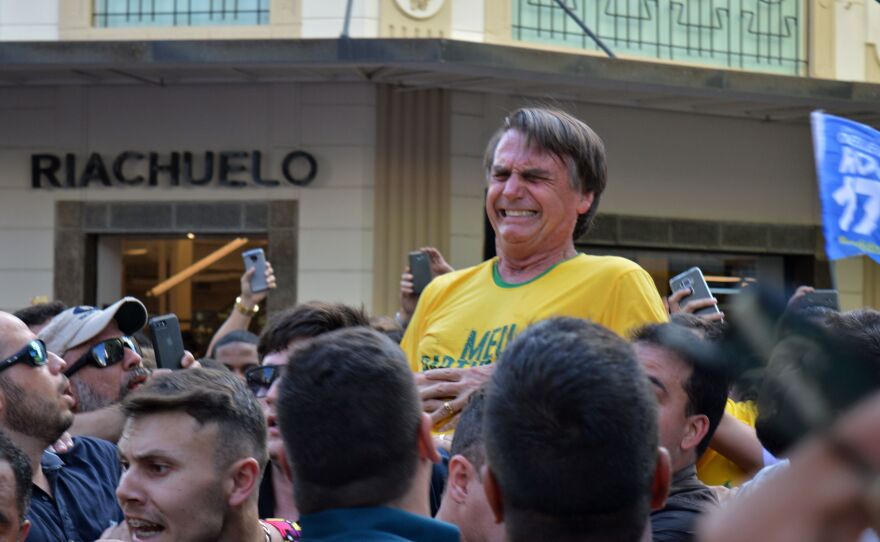 Brazilian right-wing presidential candidate Jair Bolsonaro gestures after being stabbed in the stomach during a campaign rally in Juiz de Fora, Minas Gerais state, in southern Brazil, on Thursday.