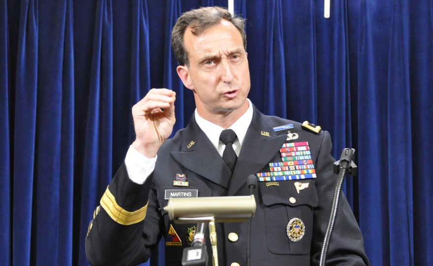 Army Brig. Gen. Mark Martins, Guantánamo's chief prosecutor, addresses the media on Oct. 19, 2012, at the end of a week of pretrial hearings for the five alleged architects of the 9/11 attacks. Martins announced his retirement this week.