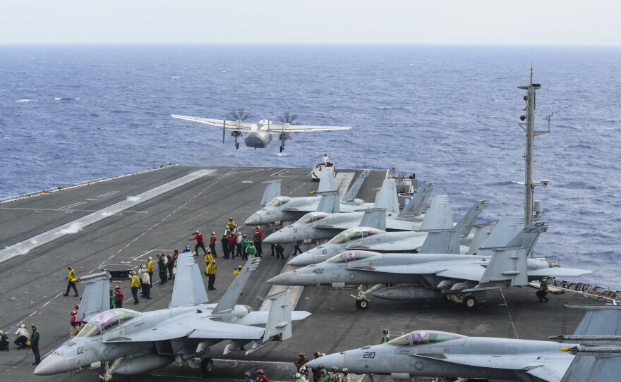 A C-2A Greyhound launches from the flight deck of the aircraft carrier USS Ronald Reagan on Nov. 17. Five days later a C-2A crashed into the Philippine Sea. Three sailors were lost at sea.