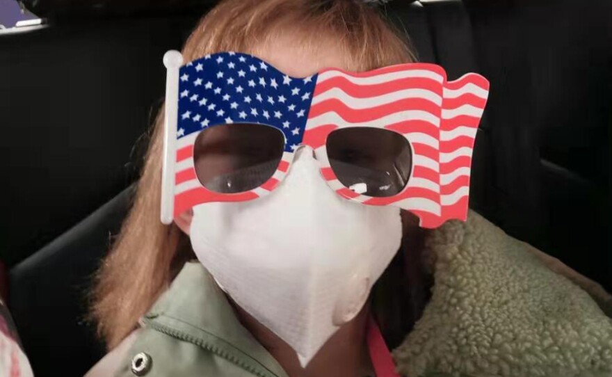 Hermione Dickey, 8, and her mother, Priscilla, head to the Wuhan Tianhe International Airport. They were among the passengers on a U.S. evacuation flight out of Wuhan, China.