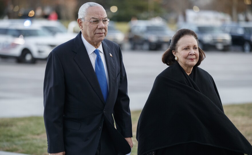 Former Secretary of State Colin Powell, seen here in December 2018 with his wife, Alma, said he would vote for Joe Biden.