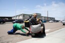Chris Von Kroog gets help from a friend to push his mobility scooter towards his storage unit after the battery died overnight, San Diego, June 3, 2022.