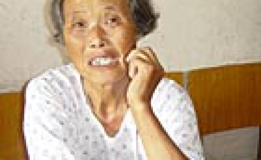 Zhou Jianming is a resident of the rural Anhui province. Local government officials took some of her land and sold it to a company building a pharmaceutical factory.