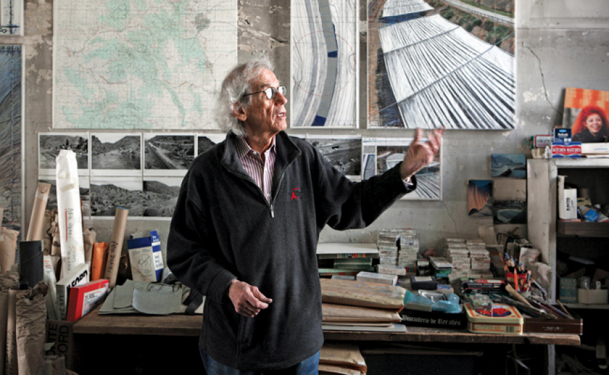 Cursor over the photo to explore Christo's workspace.