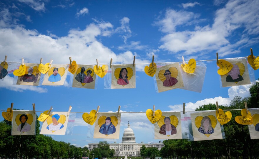 A "Yellow Heart Memorial" on the National Mall in Washington, D.C. in May 2021 displays names of people who died from COVID-19.