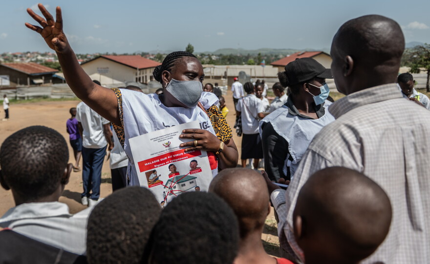 Vanny Birungi, a Red Cross volunteer, speaks to people during a public sensitisation campaign amid the Ebola outbreak in Bunia, Congo, Monday, May 25, 2026.