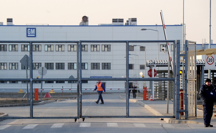 A security guard at the General Motors factory outside St.  Petersburg. Opel, the European arm of GM, announced last week it was withdrawing from the Russian market, where sales are falling.