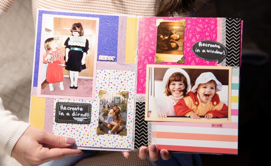 Sofie Elliott displays a scrapbook with photographs of herself and her sister, Simone Elliott.