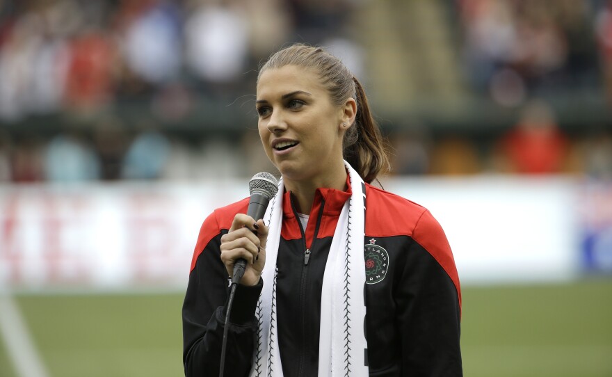 Portland Thorns forward Alex Morgan speaks to the crowd before their NWSL soccer match against the Seattle Reign in Portland, Ore., July 22, 2015.