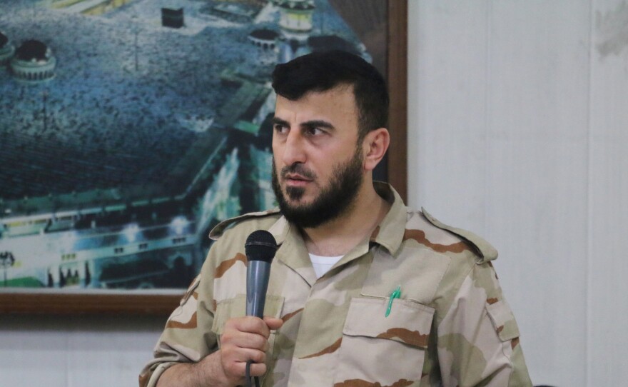 Zahran Alloush, head of the Army of Islam Syrian rebel group, speaks during the wedding of a fighter in the group on July 21, 2015, in the rebel-held town of Douma, Syria.
