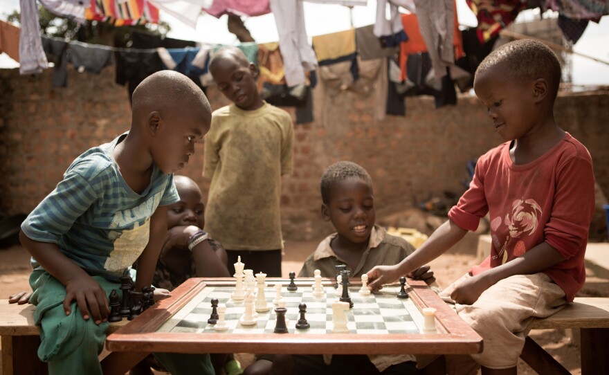 Children make their moves at the Katwe Chess Academy, located in a slum in Kampala, Uganda. The Academy is where Phiona Mutesi, whose story is the basis for the movie <em>Queen of Katwe,</em> learned to play.