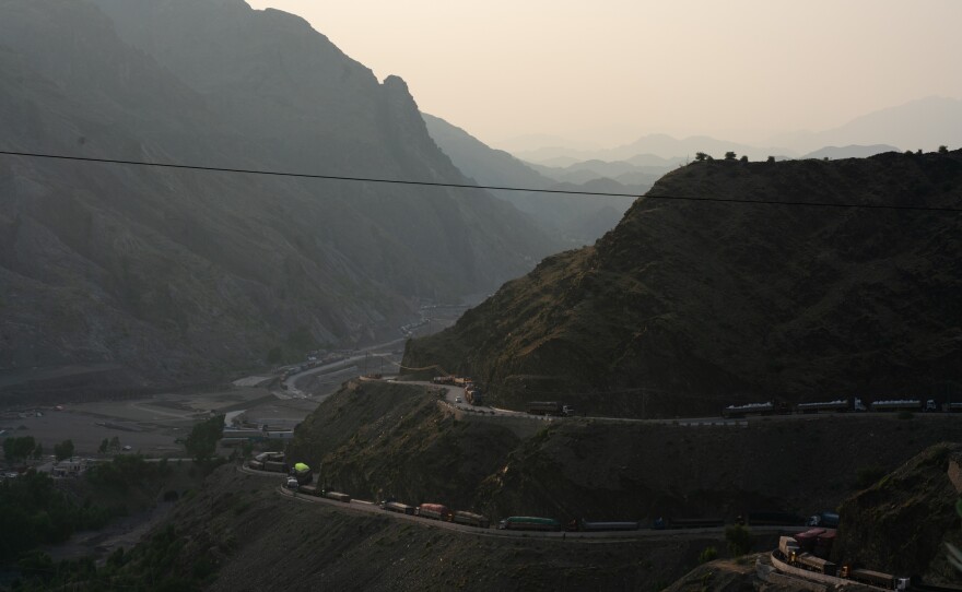 Trucks line the road as their drivers wait to get through the border to Afghanistan.