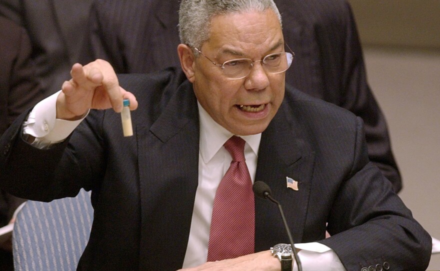 Secretary of State Colin Powell holds up a vial he said could contain anthrax as he presents evidence of Iraq's alleged weapons programs to the United Nations Security Council on Feb. 5, 2003. That evidence proved "flawed," as Powell said later.