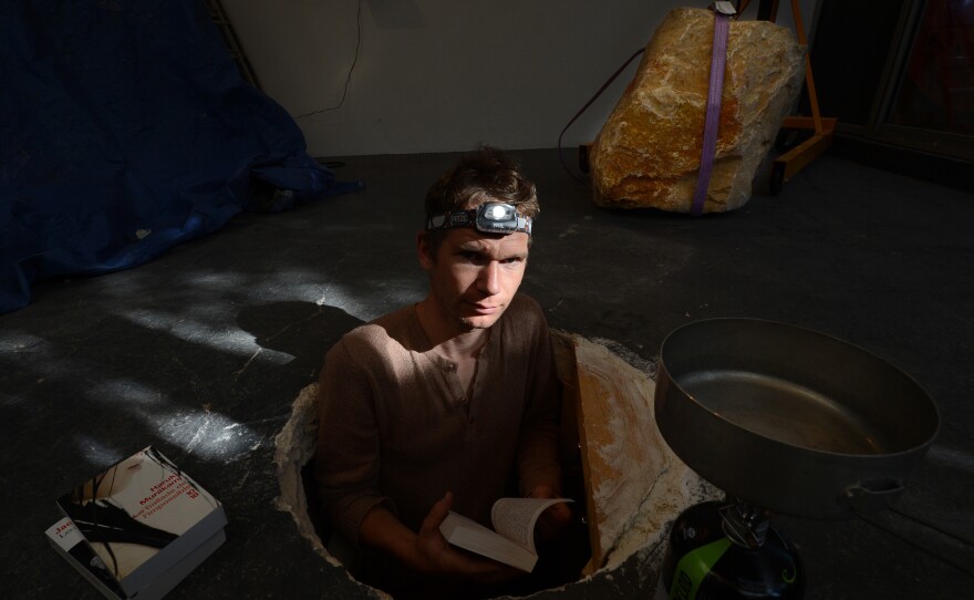 Poincheval poses in September 2012 in Marseille, France, before starting <em>604,800 Seconds</em>, in which he stayed in a hole blocked by a stone weighing a ton for seven days.