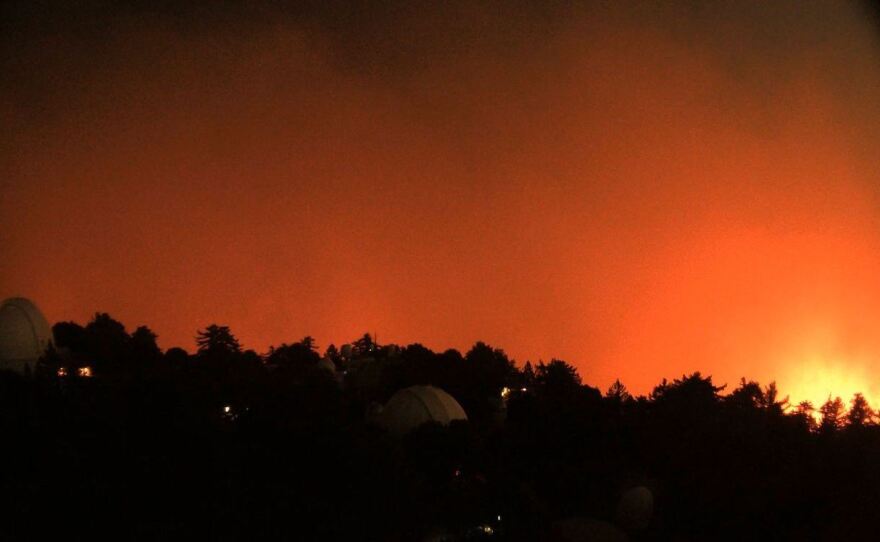 A view facing east from the historic Mt. Wilson Observatory near Los Angeles shows the nearby flames of the Bobcat Fire early Wednesday morning.
