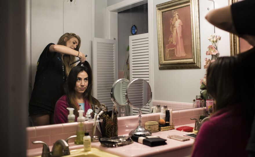 Claudia De La Vega has her hair done the night before her wedding.
